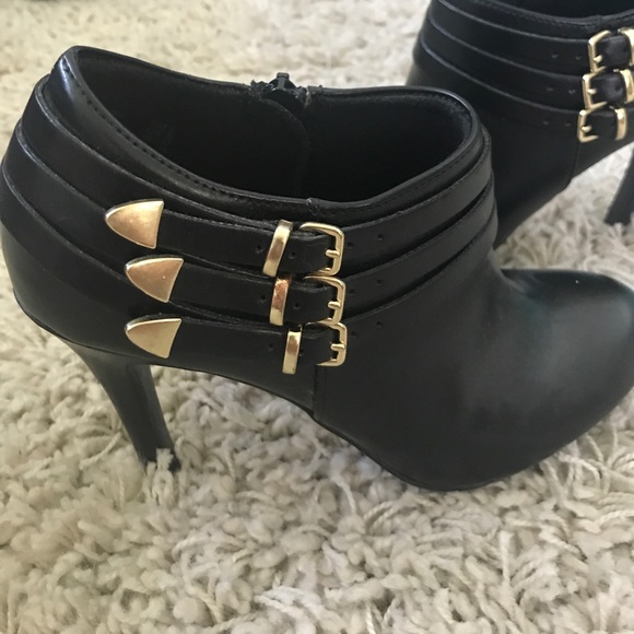 Black ankle booties with beautiful gold hardware. - Picture 5 of 6