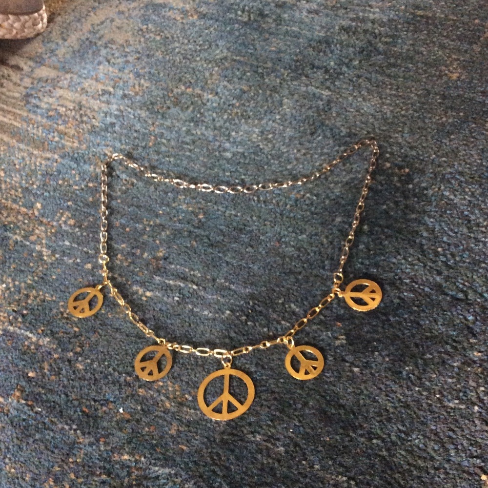 Gold colored peace necklace
