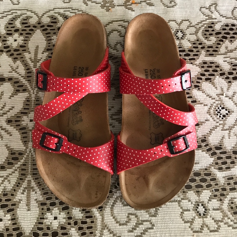 Red and white Birkenstocks