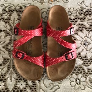 Red and white Birkenstocks