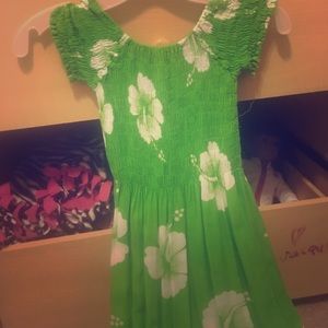 A lime green stretchy dress with floral design