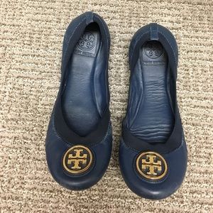 blue flats with gold detail