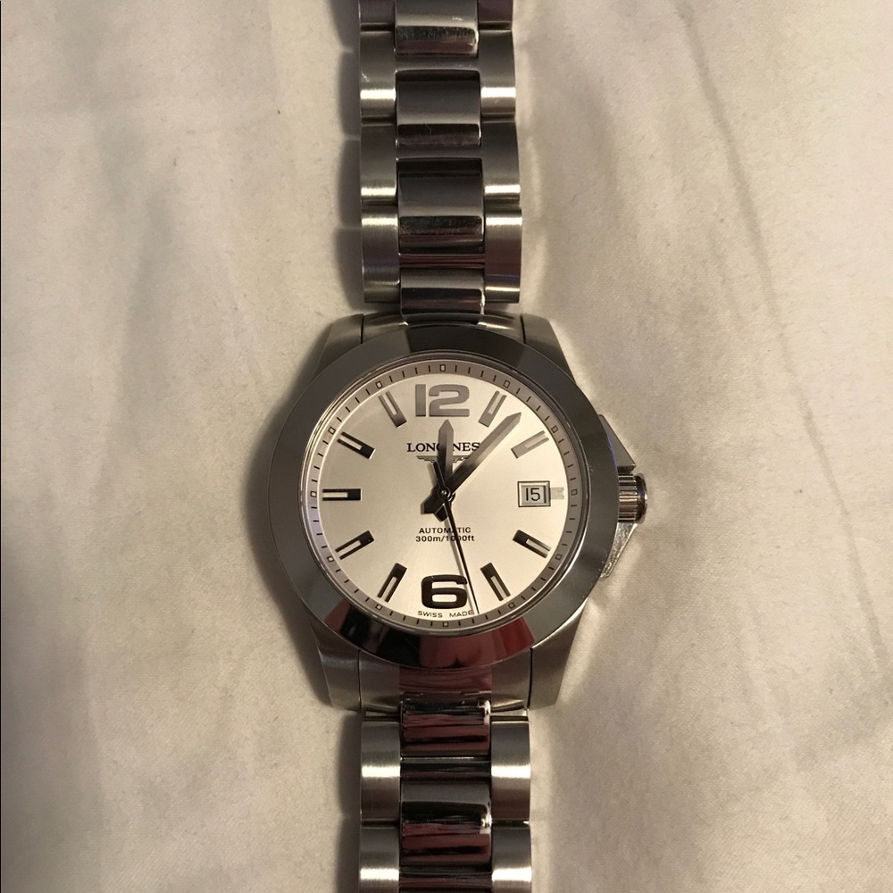 Longines Conquest Automatic with papers and box.