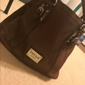 A genuine brown leather, medium sized purse