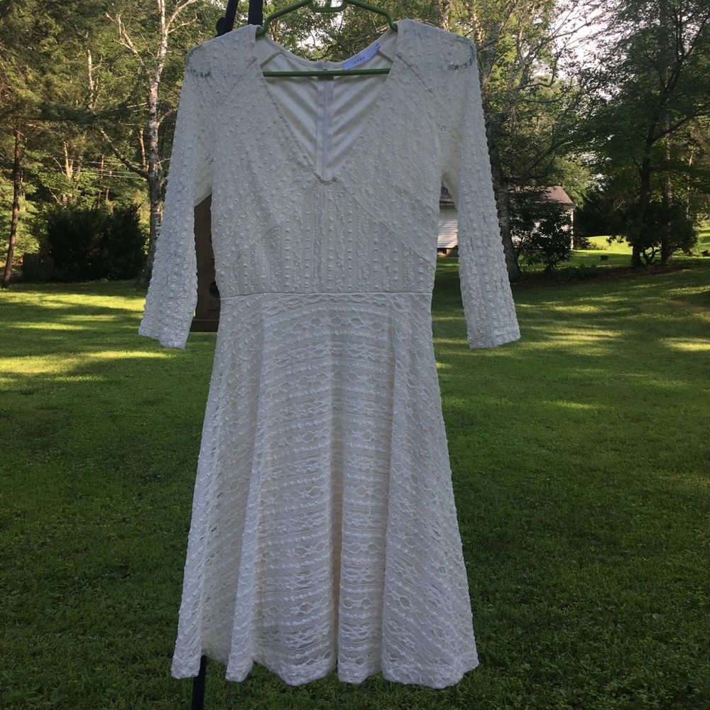 Off white colored stretch lace dress