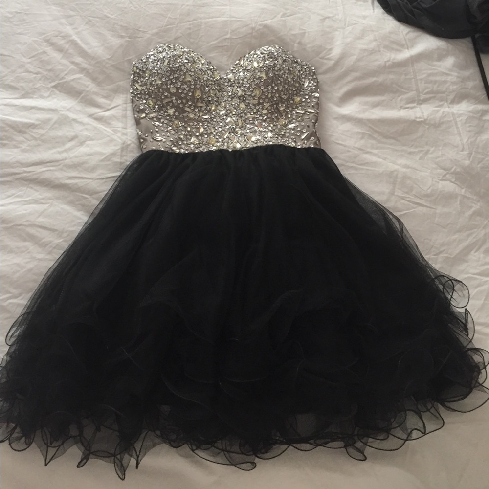 Coya Collection short black homecoming dress.