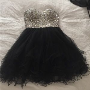 Coya Collection short black homecoming dress.