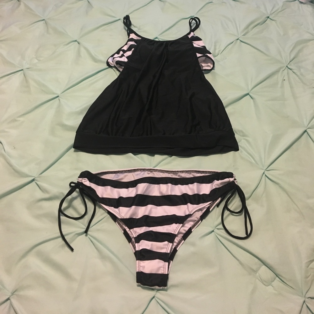 Two piece swim suit. Black & white.