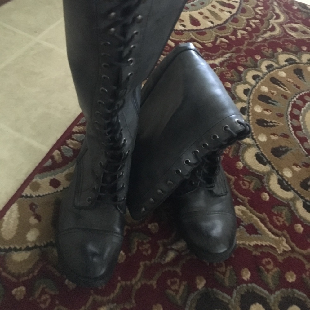 Gray combat to the knee boots.
