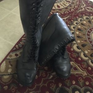 Gray combat to the knee boots.