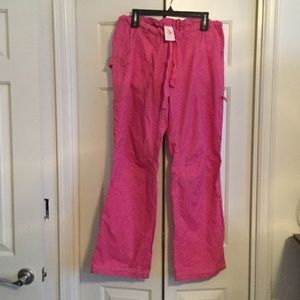 Pink Koi scrub pants with lime green stitching