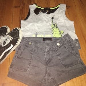 Charcoal grey cargo shorts.
