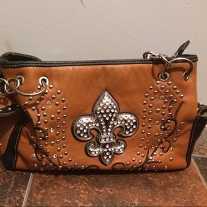 A medium sized light brown leather purse