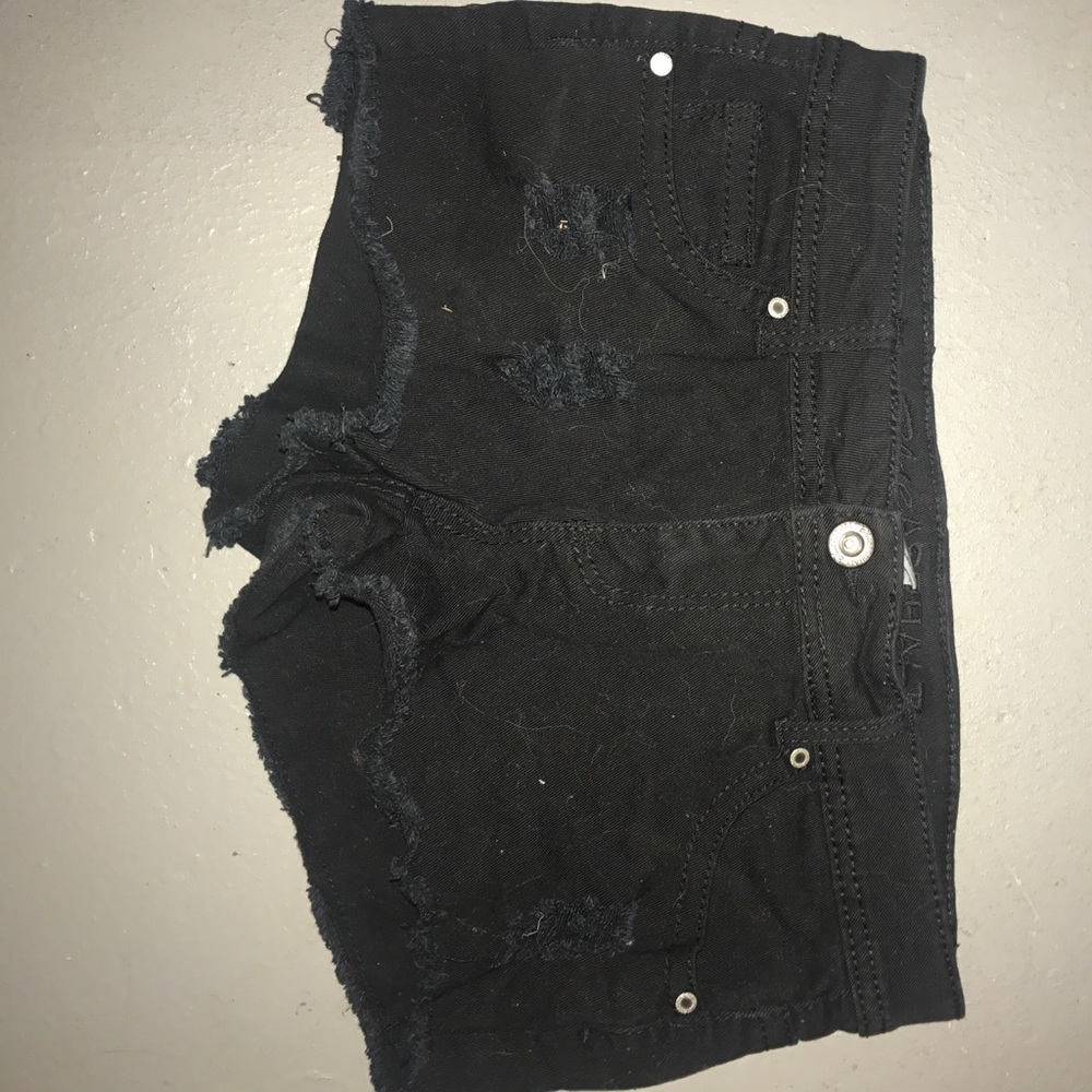 Black Jean shorts with holes