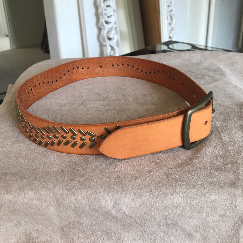 Handmade leather belt with brass rivets