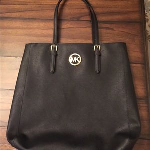 Michael Kors large, black bag with gold details