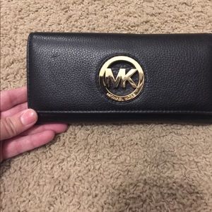 Black leather michael Kors wallet with gold detail