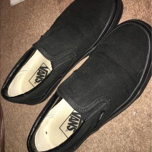 All black slip on vans