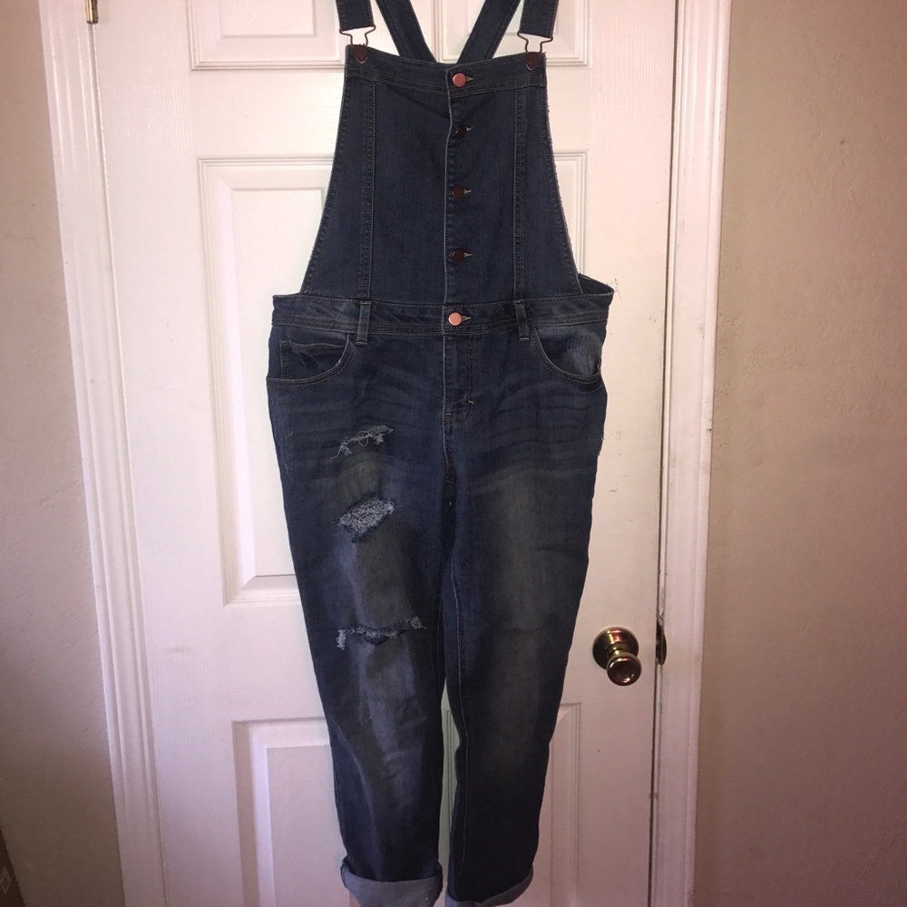 Blue jean overalls with slits on leg