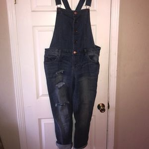 Blue jean overalls with slits on leg