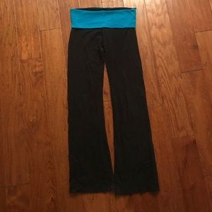 Yoga pants with a blue/teal waistband