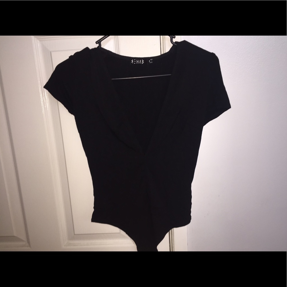 Deep V-neck black body suit. Never worn.