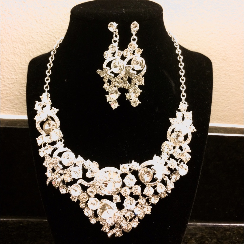 Silver necklace and earrings jewelry set.