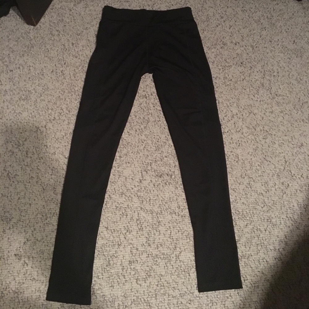 Workout leggings with mesh detail on leg.