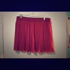 Dark red chiffon mini skirt.