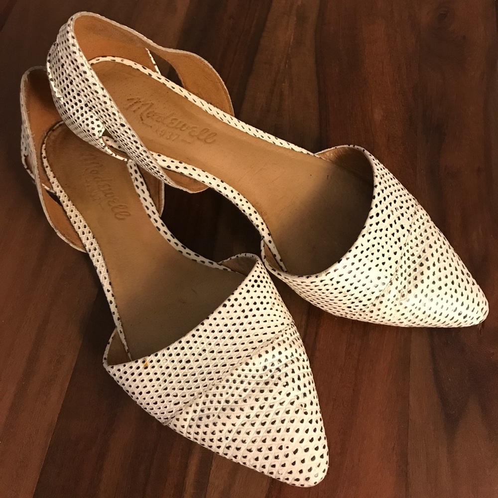 Flat pointed toe shoes.