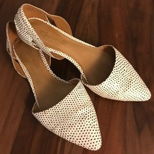 Flat pointed toe shoes.