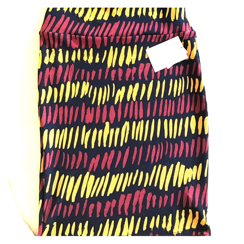 Small cassie, NWT. Navy w/ yellow and red accents