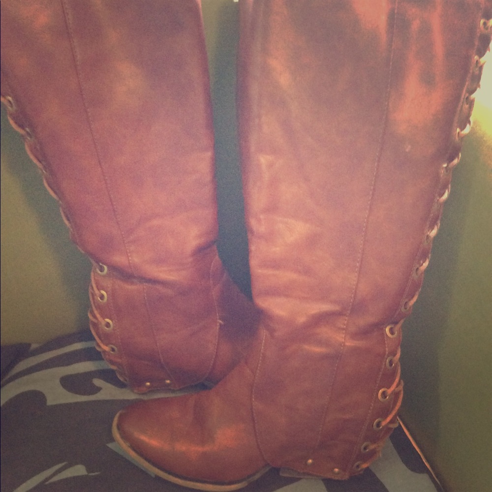 Tall brown wedge boot with lace back