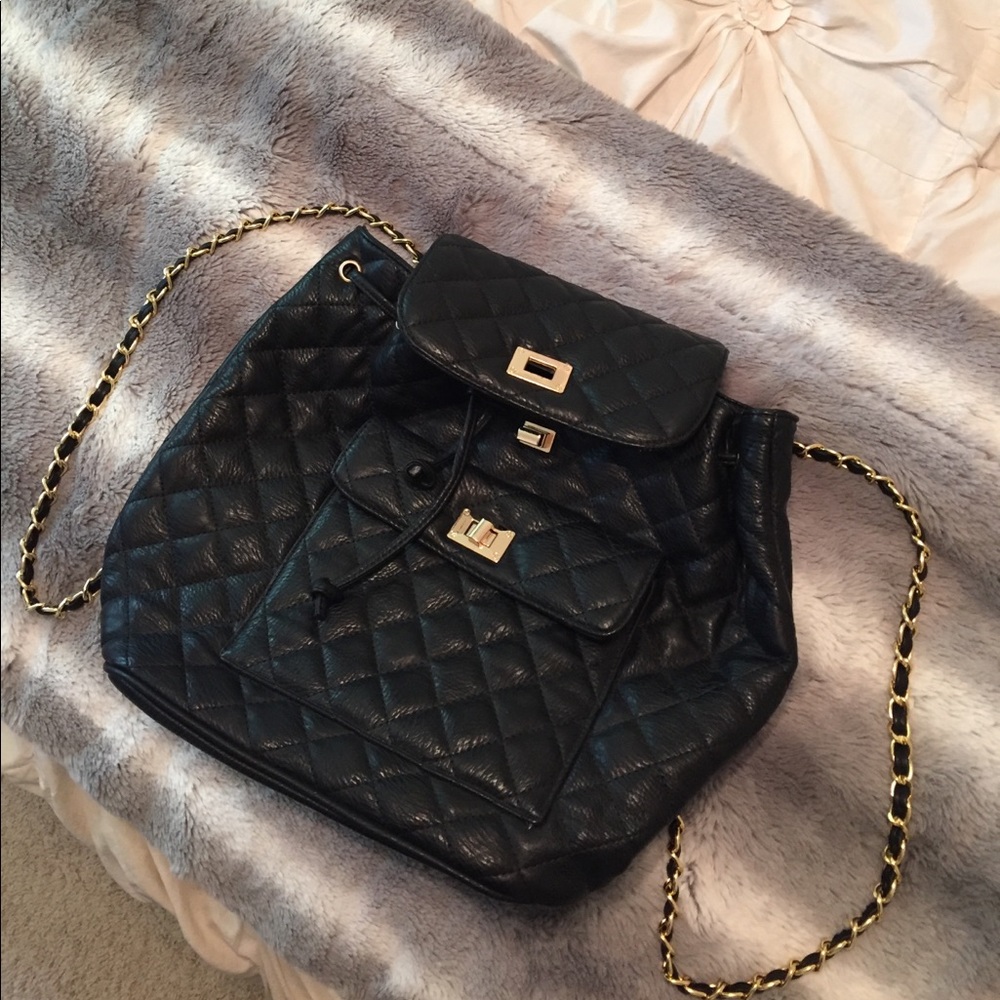 Quilted backpack w/ gold detailing