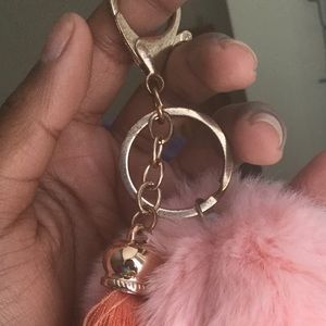 Cut little puff ball with tassel