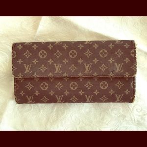 Louis Vuitton Monogram Mini Lin wallet.