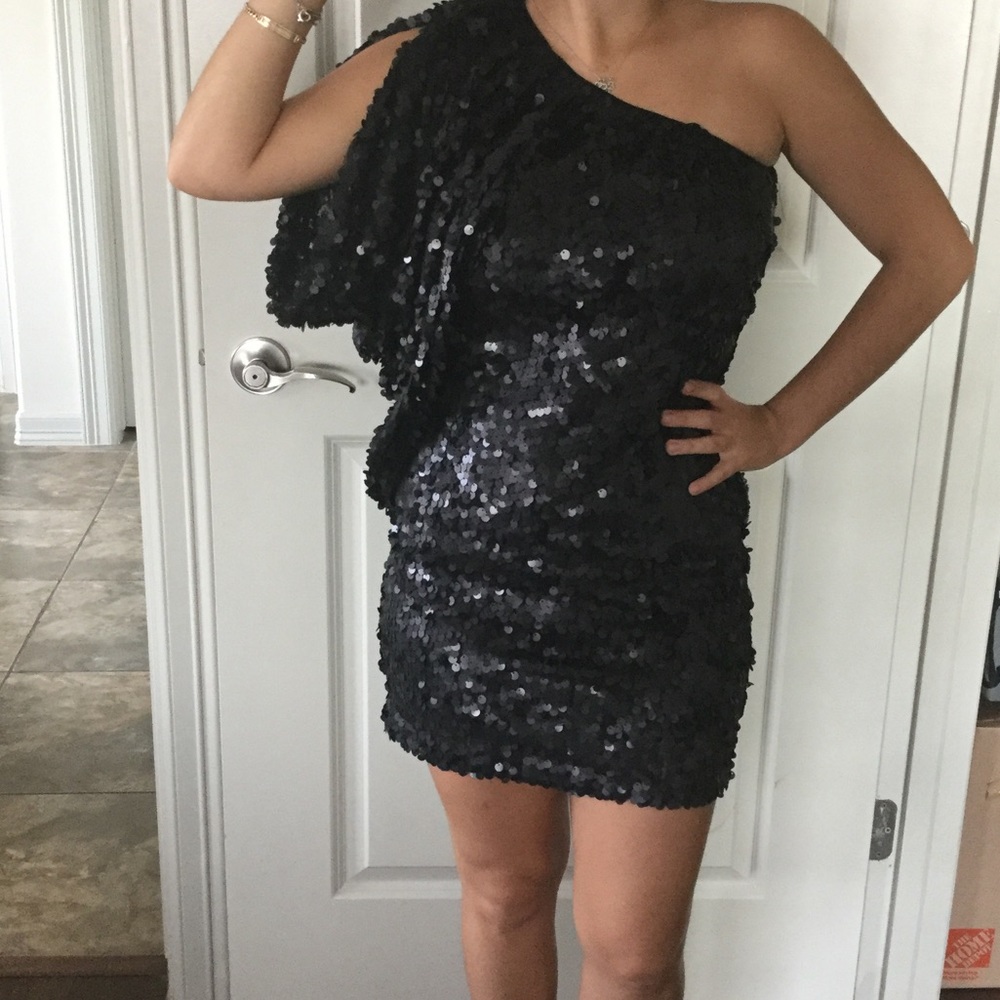 Off the shoulder sequence dress.