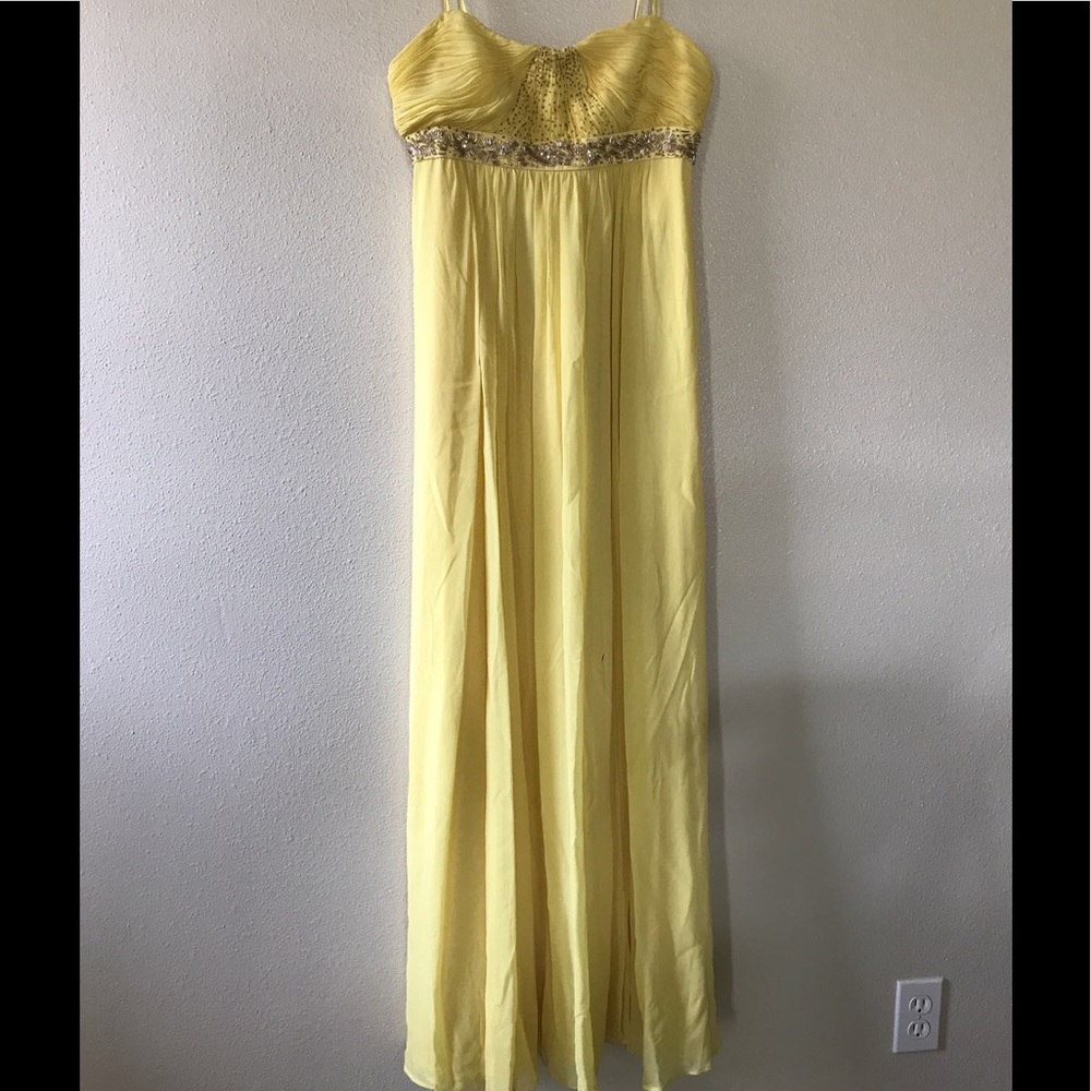 Yellow long dress with beads.