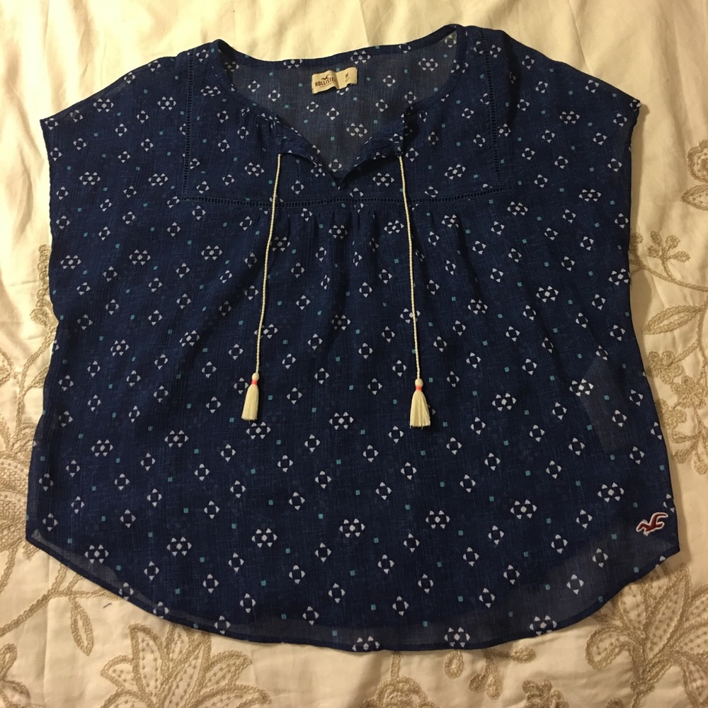 Super cute blue Hollister shirt with tassels
