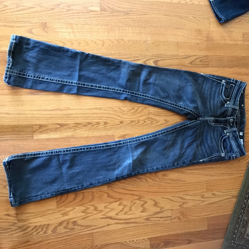 Dark wash Miss Me jeans.