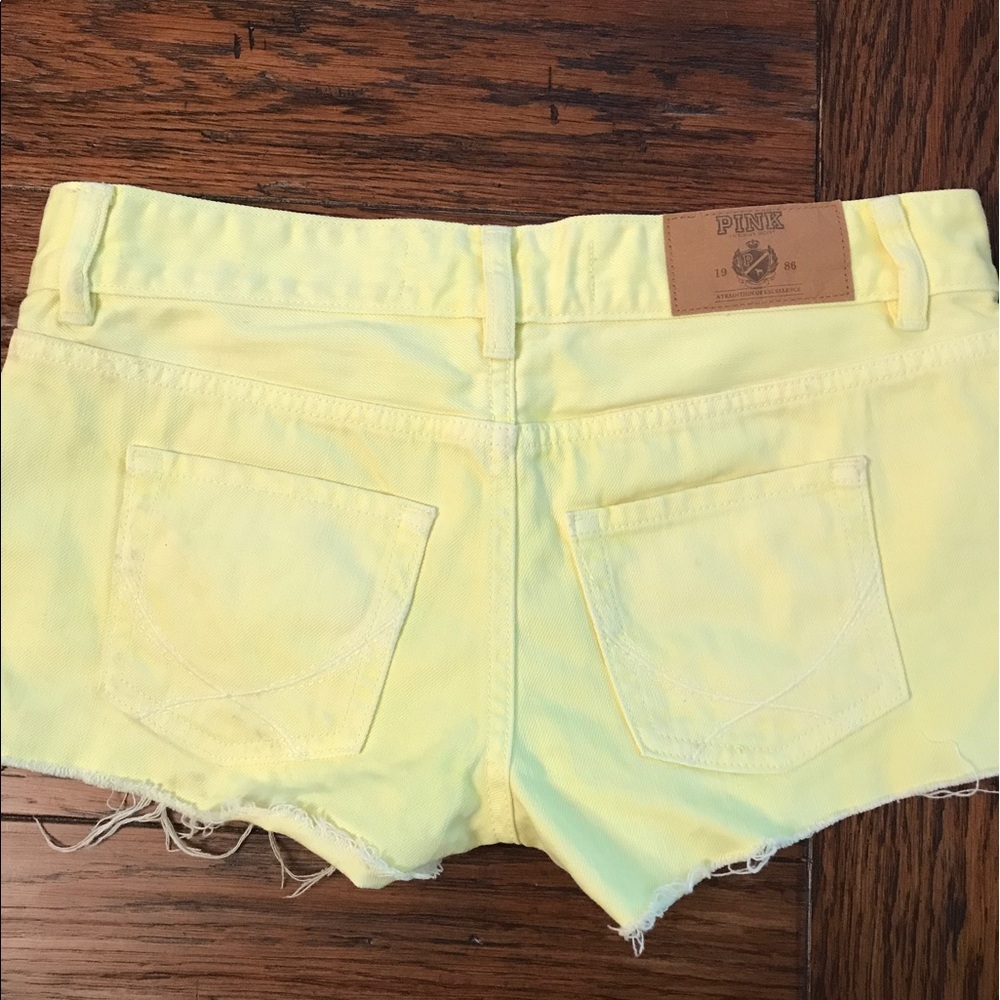 NWOT yellow distressed shorts by VS PINK Size 0