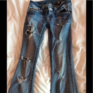 Fitting miss me jeans. Light colored and holes