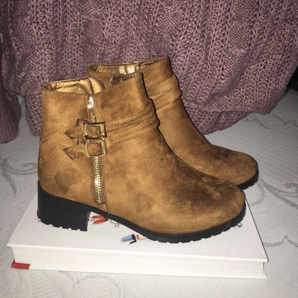 Ankle buckled boots.