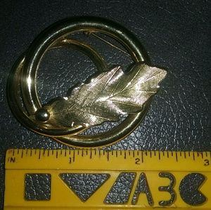 Gold tone brooch