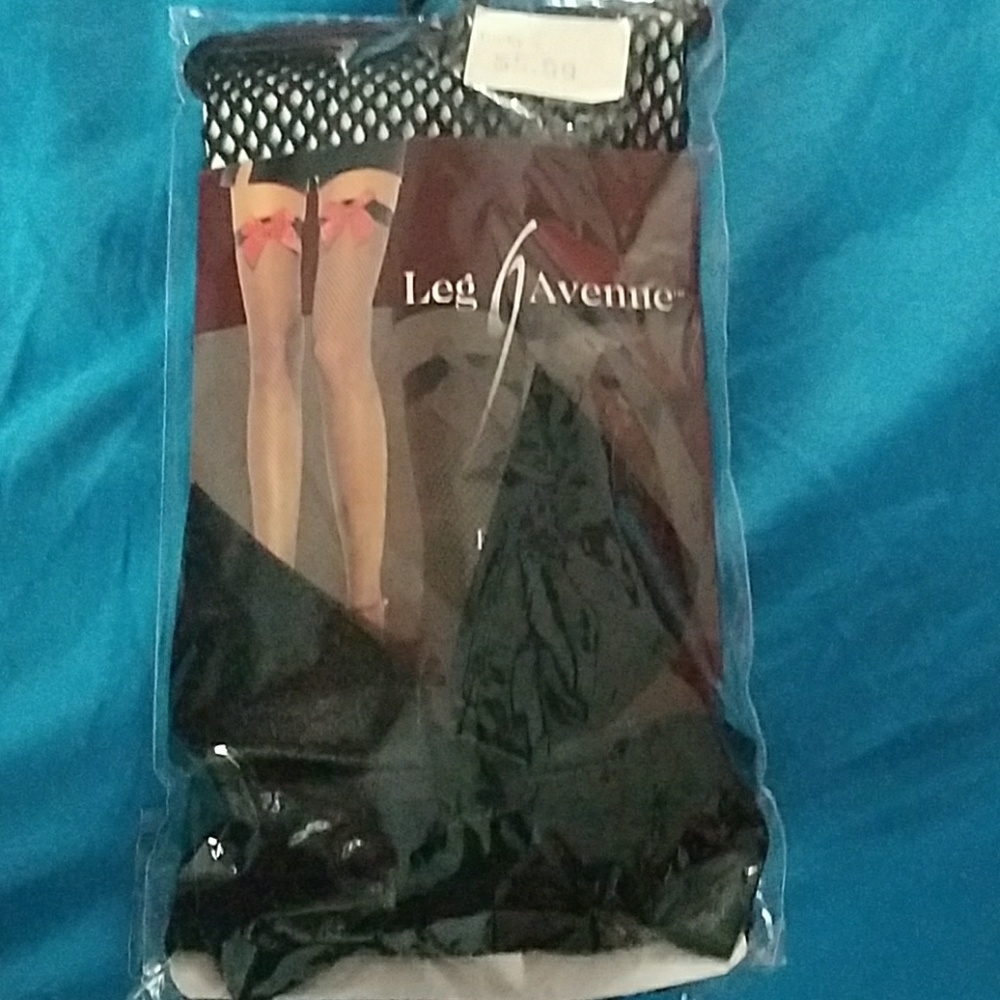 Thigh high fishnets with black silk bow