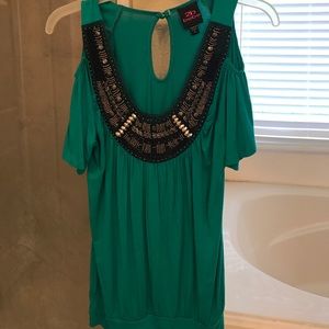 Jeweled peek through shoulder blouse.