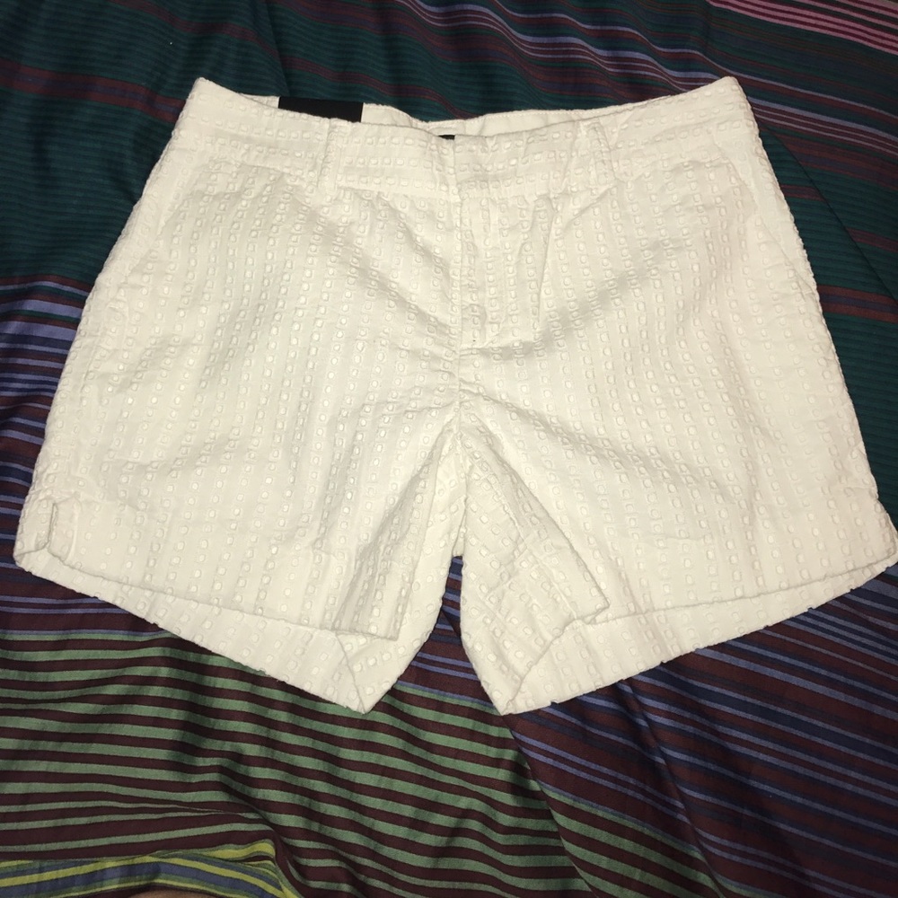 White eyelet shorts. New. Never worn before.