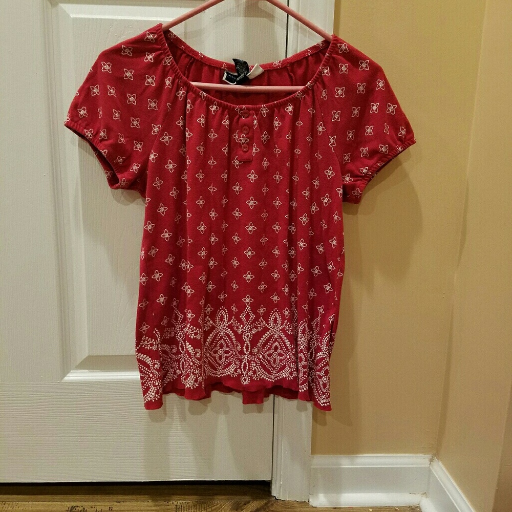Red short sleeve with white design shirt