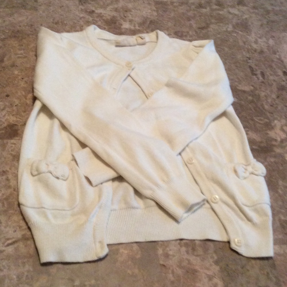 A beautiful white little jacket for little girls