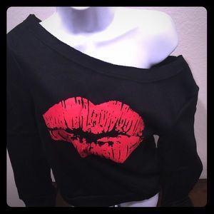 Off brand "kiss" one shoulder sweat shirt.